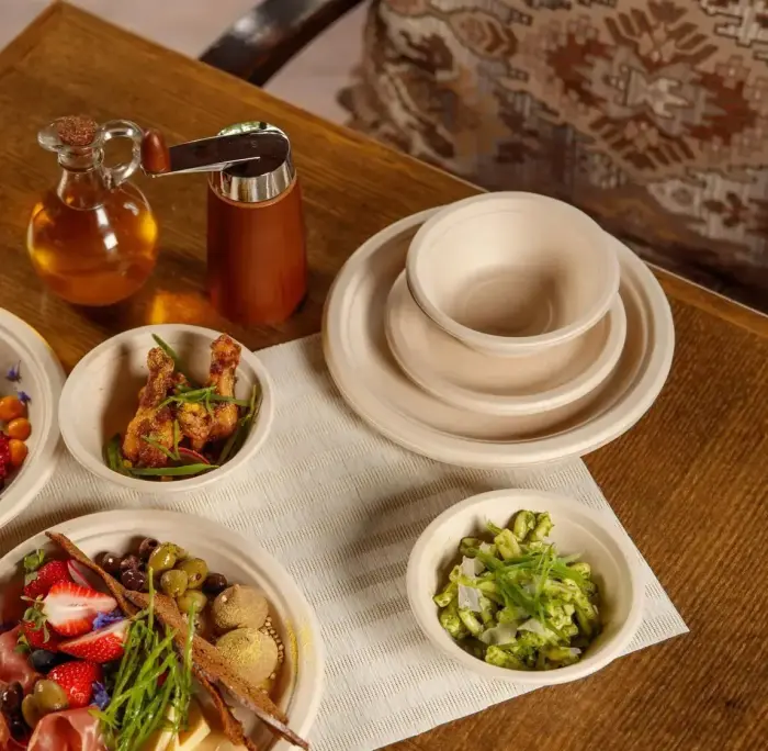 Compostable sugar cane plates Go Green Photo